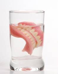 dentures in a glass